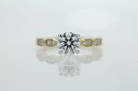 Four Claw Diamond Engagement Ring with Marquise Shapes on Band