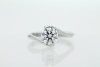 Twisted Band Diamond Engagement Ring With A Four Claw Setting