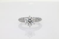 Six Prong Diamond Engagement Ring Featuring Diamonds on Side and Claws