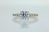 Four Claw Diamond Engagement Ring With Claw Pave Set Round Diamonds on Shoulders