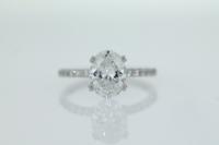 Four Claw Diamond Engagement Ring With Shared Claw Diamonds on Shoulders